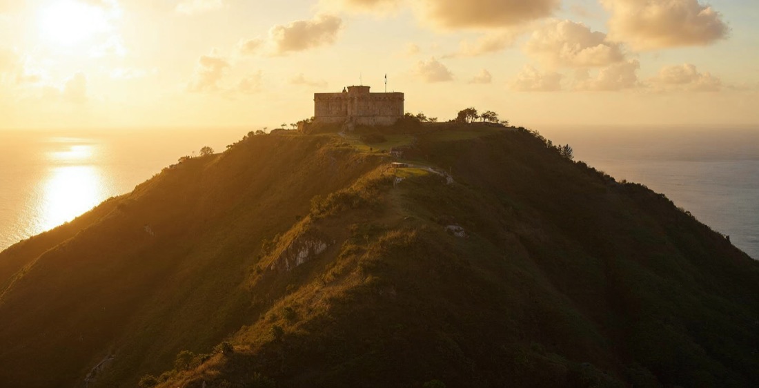 Brimstone Hill Fortress on a hill in Saint Kitts, Caribbean, at sunset.