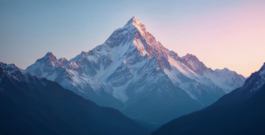 Mount Everest peak in Nepal at sunrise with snow-covered ridges.